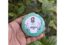 Pomegranate Lip Balm held in garden - Good Origins Store
