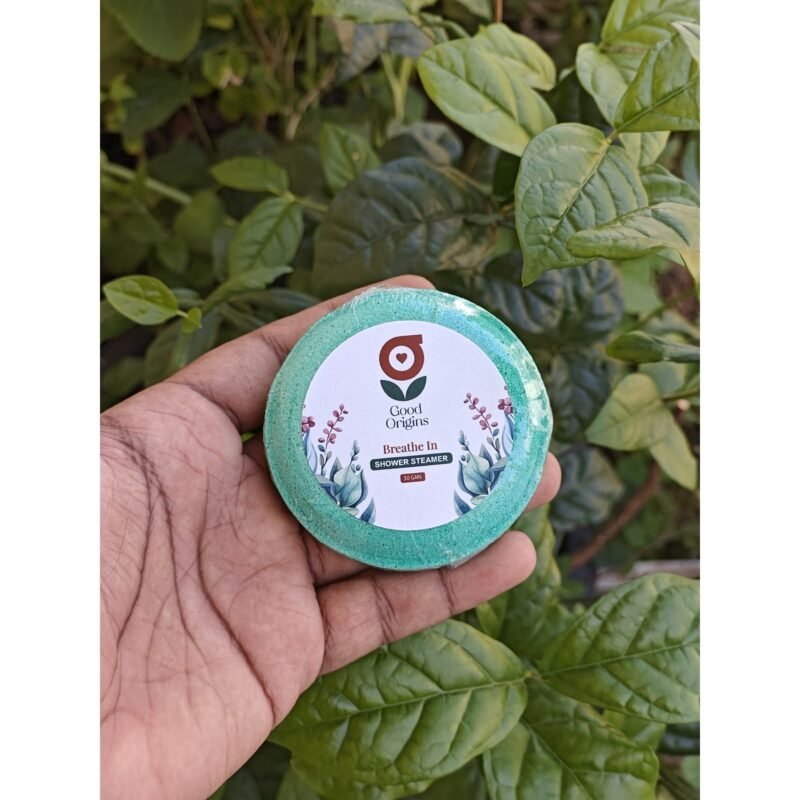 Pomegranate Lip Balm held in garden - Good Origins Store